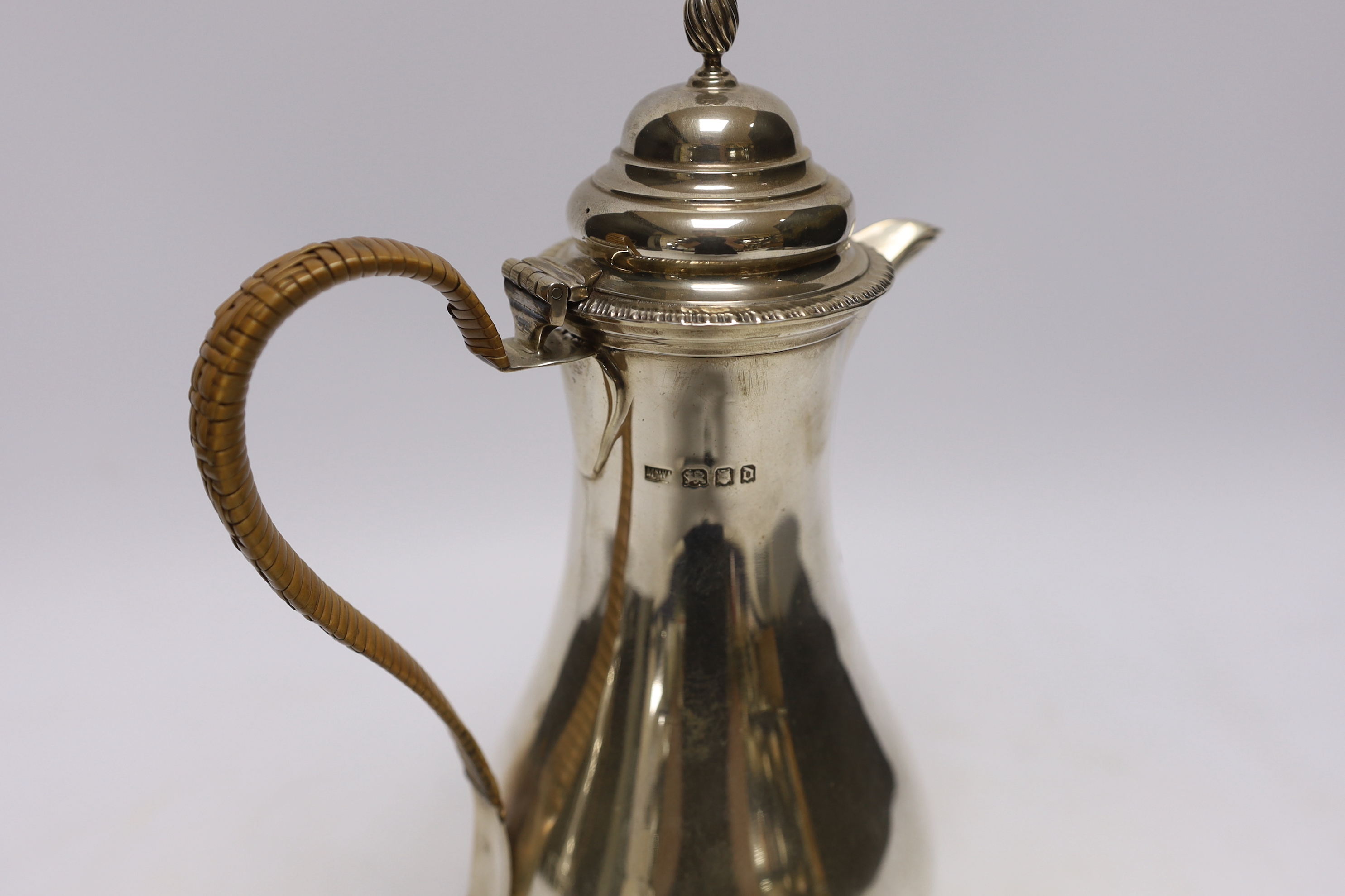 A George V silver baluster hot water pot by Mappin & Webb, London, 1919, height 25.5cm, gross weight 17.7oz.